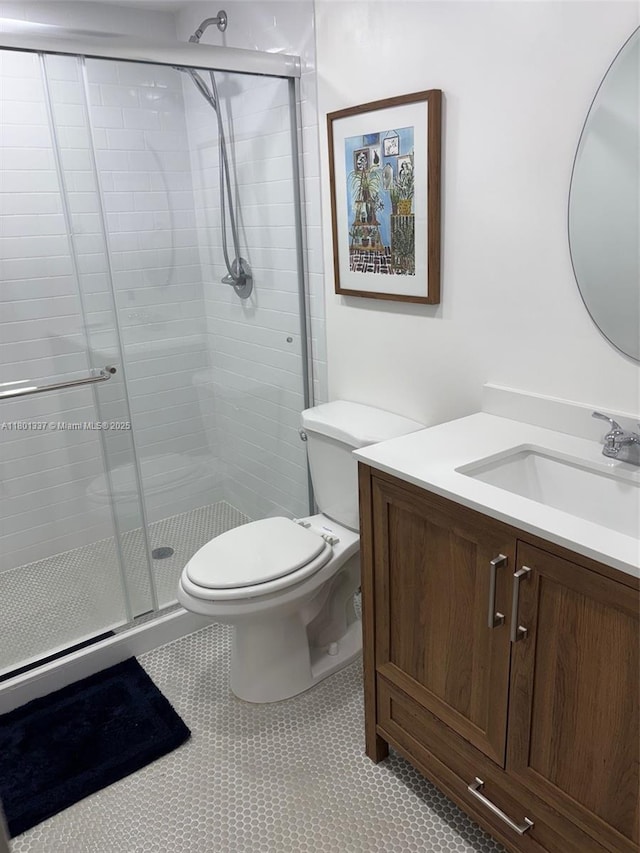 1100 Salzedo St Unit 3A, Coral Gables, FL 33134 - bathroom with a shower stall, toilet, vanity, and tile patterned floors