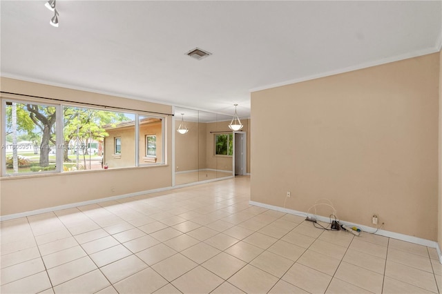 1090 Meadowlark Ave, Miami Springs, FL 33166 - empty room featuring light tile patterned floors and crown molding