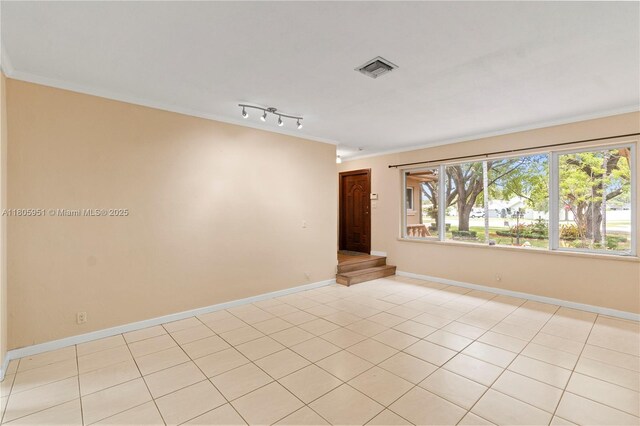 1090 Meadowlark Ave, Miami Springs, FL 33166 - empty room with ornamental molding, healthy amount of natural light, and light tile patterned floors