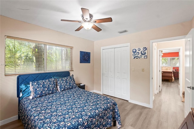 1090 Meadowlark Ave, Miami Springs, FL 33166 - bedroom with light wood-type flooring, a closet, and a ceiling fan