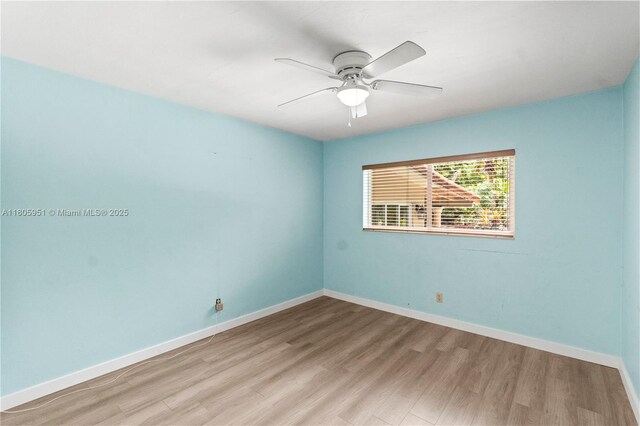 1090 Meadowlark Ave, Miami Springs, FL 33166 - spare room featuring light wood-type flooring and a ceiling fan