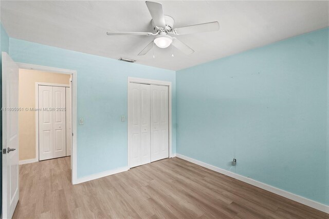 1090 Meadowlark Ave, Miami Springs, FL 33166 - unfurnished bedroom with wood finished floors, a closet, and a ceiling fan