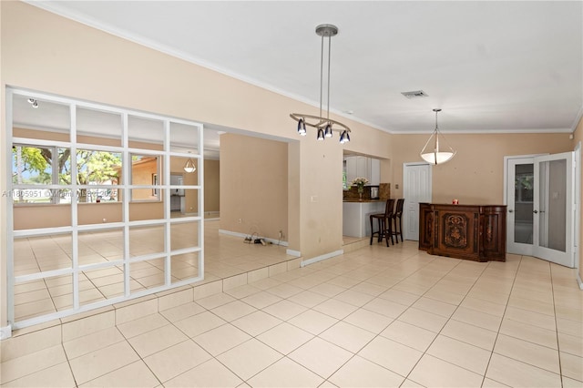 1090 Meadowlark Ave, Miami Springs, FL 33166 - empty room with light tile patterned floors, ornamental molding, and a chandelier