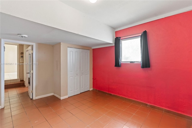 1090 Meadowlark Ave, Miami Springs, FL 33166 - unfurnished bedroom featuring light tile patterned flooring and a closet
