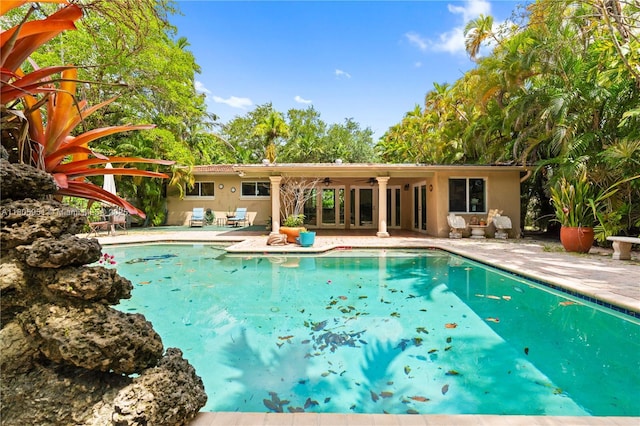 1090 Meadowlark Ave, Miami Springs, FL 33166 - swimming pool featuring ceiling fan and a patio area
