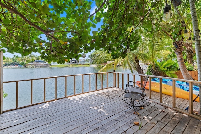 1090 Meadowlark Ave, Miami Springs, FL 33166 - wooden deck featuring a water view