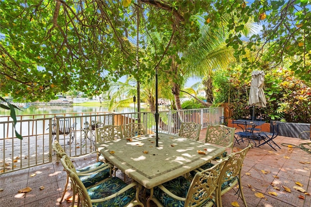1090 Meadowlark Ave, Miami Springs, FL 33166 - view of patio / terrace featuring outdoor dining area and a deck with water view