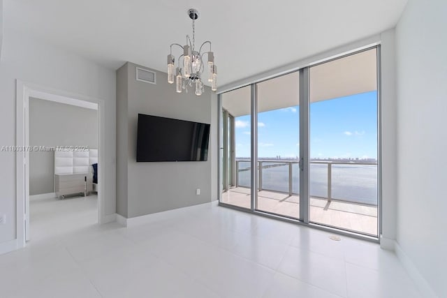 2900 NE 7th Ave Unit 3605, Miami, FL 33137 - unfurnished room with a chandelier, tile patterned floors, and baseboards