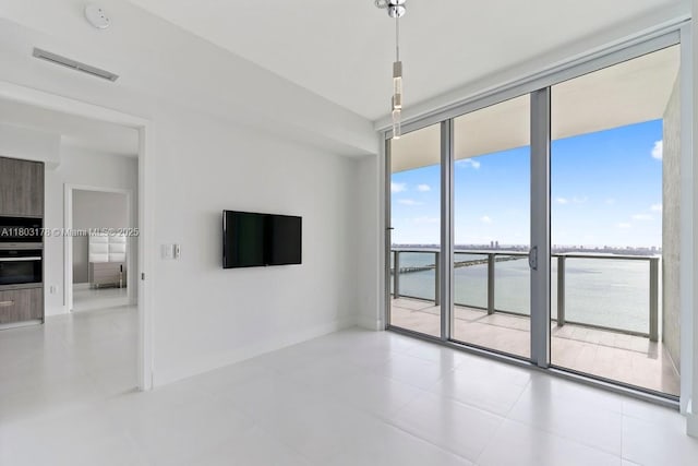 2900 NE 7th Ave Unit 3605, Miami, FL 33137 - unfurnished room featuring baseboards, tile patterned flooring, and a smoke detector