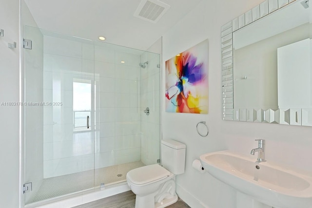 2900 NE 7th Ave Unit 3605, Miami, FL 33137 - full bathroom with a sink, a stall shower, toilet, and recessed lighting