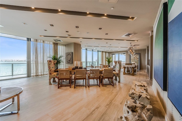 2900 NE 7th Ave Unit 3605, Miami, FL 33137 - dining area featuring floor to ceiling windows, light wood-type flooring, and a water view