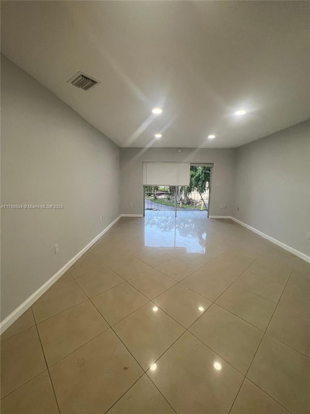 7368 SW 82nd St Unit E215, Miami, FL 33143 - tiled empty room featuring baseboards and recessed lighting