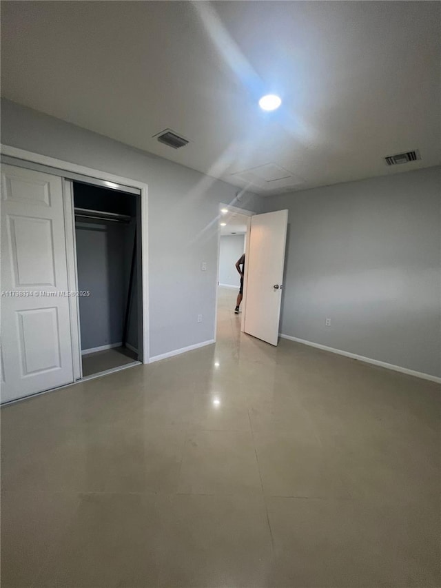 7368 SW 82nd St Unit E215, Miami, FL 33143 - unfurnished bedroom featuring baseboards, a closet, and recessed lighting