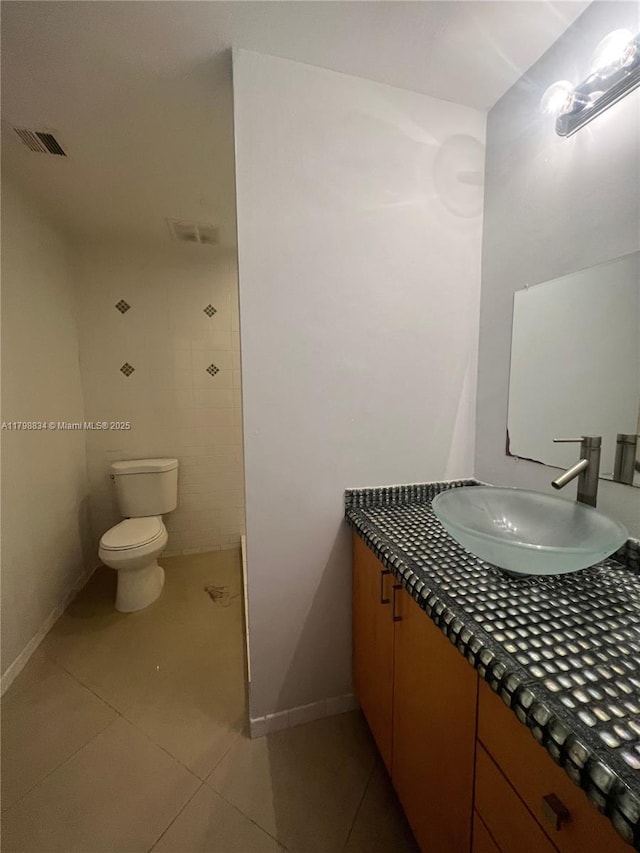 7368 SW 82nd St Unit E215, Miami, FL 33143 - bathroom featuring tile patterned flooring, toilet, vanity, and baseboards