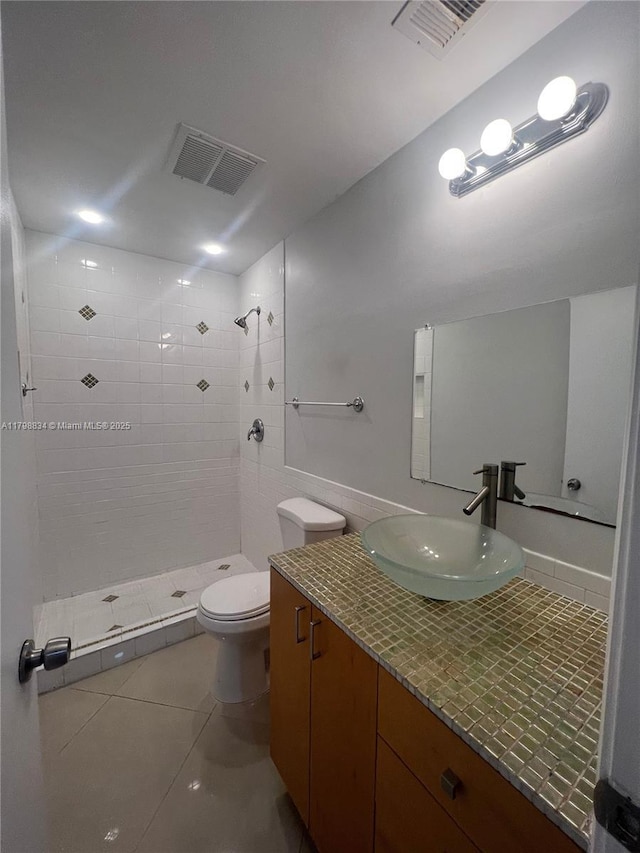 7368 SW 82nd St Unit E215, Miami, FL 33143 - bathroom featuring tile patterned flooring, a tile shower, toilet, and vanity