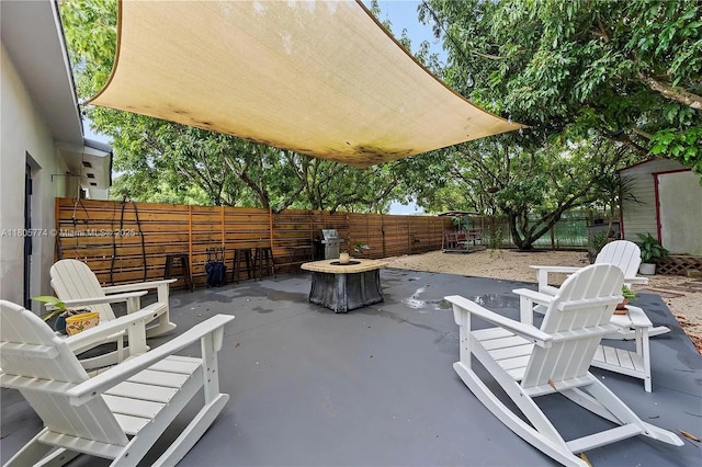 15225 SW 235th St, Homestead, FL 33032 - fenced backyard with a fire pit and a patio area