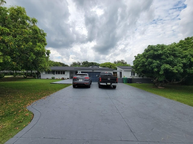 15225 SW 235th St, Homestead, FL 33032 - single story home featuring driveway, a front yard, and an attached garage