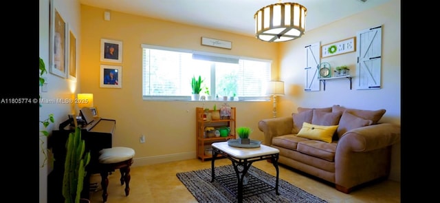 15225 SW 235th St, Homestead, FL 33032 - living area with light tile patterned floors and baseboards