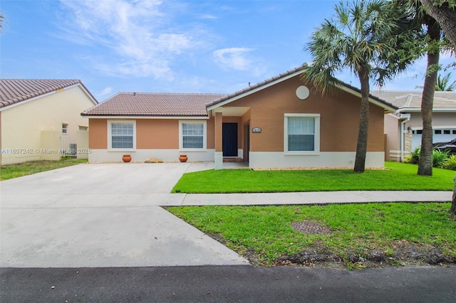 19171 NW 89th Ct, Hialeah, FL 33018 - single story home featuring a tile roof, stucco siding, concrete driveway, and a front yard