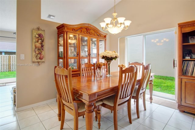 19171 NW 89th Ct, Hialeah, FL 33018 - dining area with a chandelier, light tile patterned flooring, lofted ceiling, and baseboards