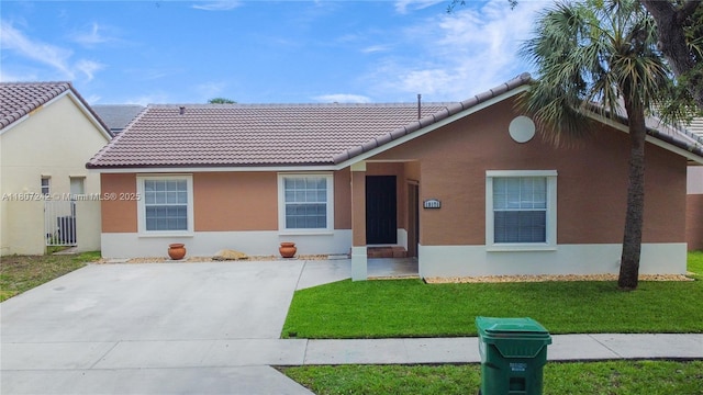 19171 NW 89th Ct, Hialeah, FL 33018 - view of front of house with stucco siding, a tiled roof, and a front yard