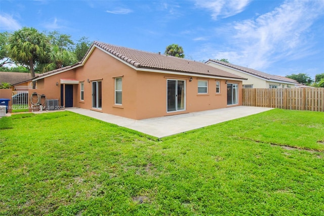 19171 NW 89th Ct, Hialeah, FL 33018 - rear view of property featuring stucco siding, a tiled roof, a patio, and central AC unit