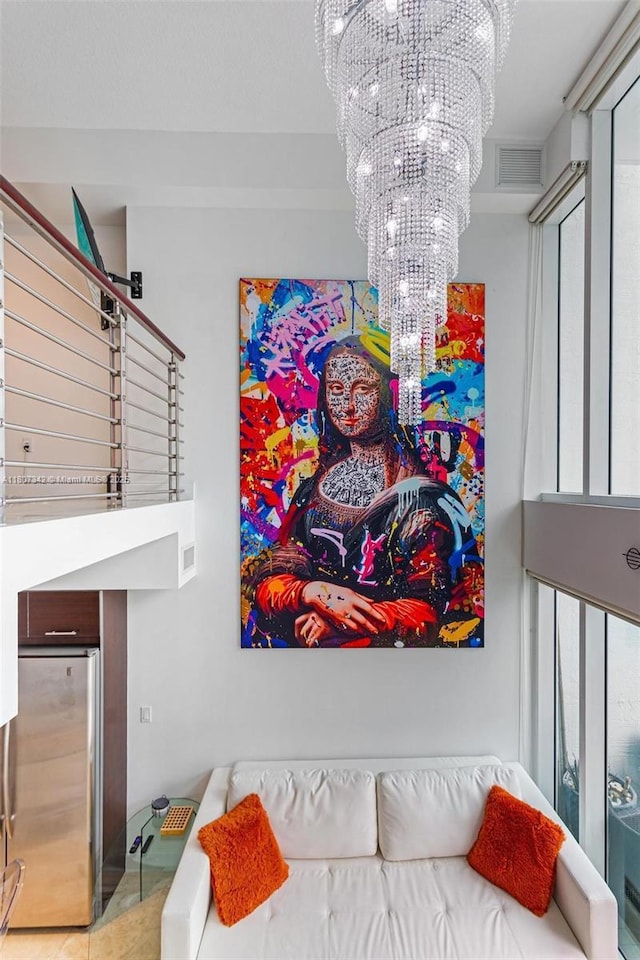41 SE 5th St Unit 2008, Miami, FL 33131 - bedroom featuring freestanding refrigerator, a chandelier, and a high ceiling