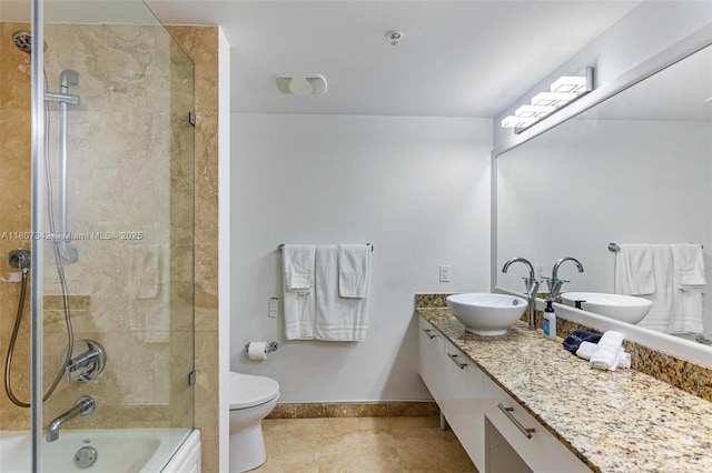 41 SE 5th St Unit 2008, Miami, FL 33131 - bathroom featuring tile patterned floors, baseboards, toilet, vanity, and bath / shower combo with glass door