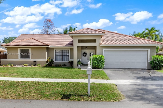 15828 S Ashby Field Rd S, Davie, FL 33331 - mediterranean / spanish house featuring stucco siding, a garage, a tile roof, concrete driveway, and a front yard