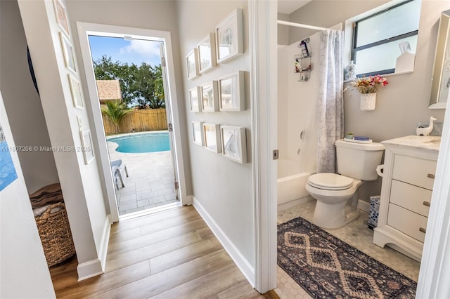 15828 S Ashby Field Rd S, Davie, FL 33331 - full bathroom featuring wood finished floors, toilet, vanity, and baseboards