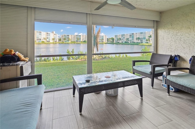 141 SE 3rd Ave Unit 101, Dania Beach, FL 33004 - sunroom featuring ceiling fan and a water view