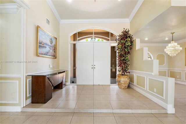 8281 SW 84th Ter, Miami, FL 33143 - foyer entrance featuring light tile patterned floors, a chandelier, ornamental molding, and recessed lighting