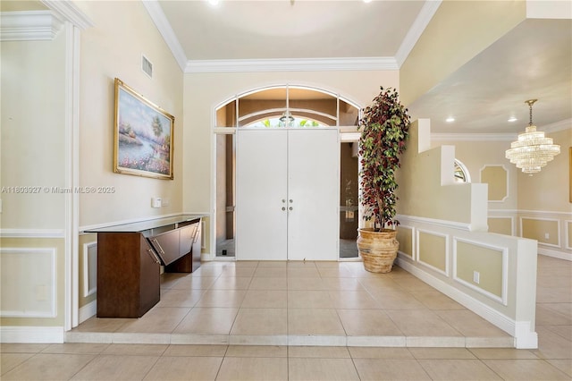 8281 SW 84th Ter, Miami, FL 33143 - entryway with light tile patterned floors, a chandelier, ornamental molding, and recessed lighting
