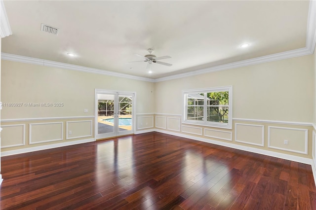 8281 SW 84th Ter, Miami, FL 33143 - spare room featuring a ceiling fan, healthy amount of natural light, a decorative wall, wood finished floors, and ornamental molding