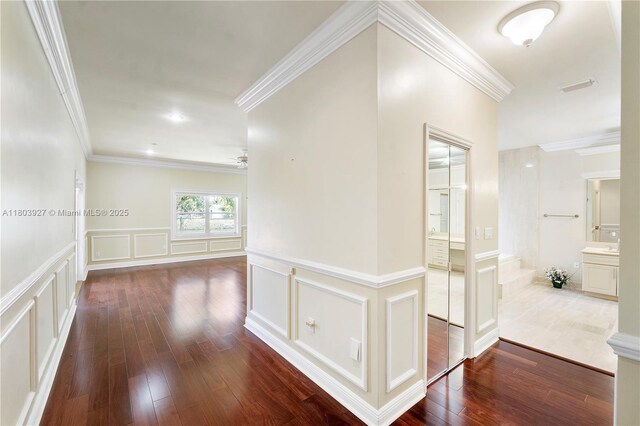 8281 SW 84th Ter, Miami, FL 33143 - hall with a decorative wall, wood-type flooring, ornamental molding, and wainscoting