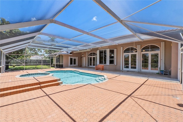 8281 SW 84th Ter, Miami, FL 33143 - view of swimming pool featuring french doors, a patio area, a lanai, and a pool with connected hot tub
