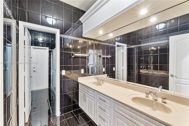 8281 SW 84th Ter, Miami, FL 33143 - bathroom featuring tile walls, double vanity, and tile patterned floors