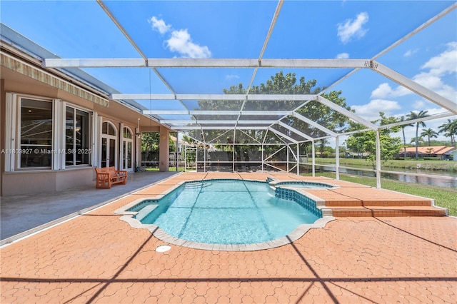 8281 SW 84th Ter, Miami, FL 33143 - view of pool with a patio area, a pool with connected hot tub, a water view, and glass enclosure