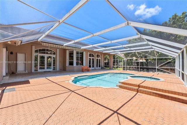 8281 SW 84th Ter, Miami, FL 33143 - view of pool with french doors, a patio, glass enclosure, and a pool with connected hot tub