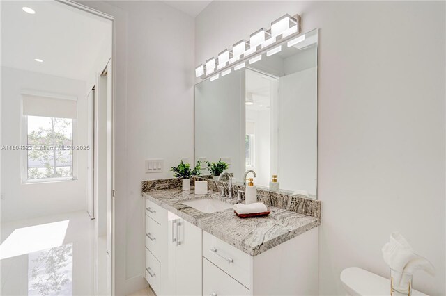 1805 NW 22nd Ct, Miami, FL 33125 - bathroom featuring toilet, vanity, and recessed lighting