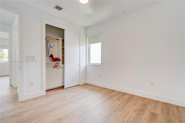 1805 NW 22nd Ct, Miami, FL 33125 - unfurnished bedroom with light wood finished floors and baseboards