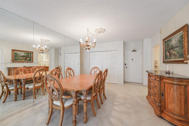 1950 S Ocean Dr Unit 3L, Hallandale Beach, FL 33009 - dining space with a chandelier, a textured ceiling, and light tile patterned floors