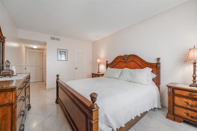 1950 S Ocean Dr Unit 3L, Hallandale Beach, FL 33009 - bedroom featuring light tile patterned floors and a textured ceiling