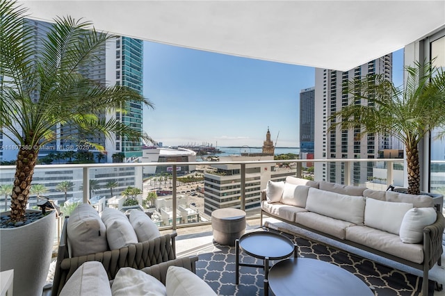 851 NE 1st Ave Unit 1409, Miami, FL 33132 - balcony with an outdoor hangout area, a water view, and a city view
