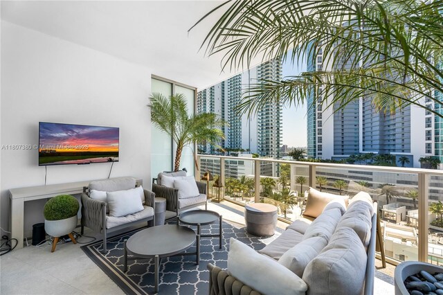 851 NE 1st Ave Unit 1409, Miami, FL 33132 - view of patio with outdoor lounge area and a balcony