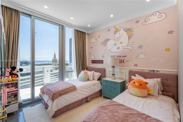 851 NE 1st Ave Unit 1409, Miami, FL 33132 - bedroom featuring ornamental molding, access to exterior, a city view, and recessed lighting