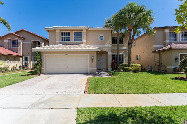 17933 SW 33rd Ct, Miramar, FL 33029 - mediterranean / spanish-style house featuring stucco siding, driveway, a front yard, and a tiled roof