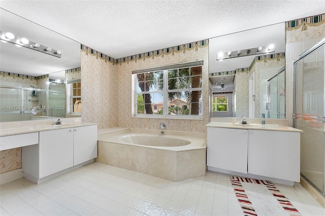17933 SW 33rd Ct, Miramar, FL 33029 - full bathroom featuring a textured ceiling, a shower stall, two vanities, a bath, and tile patterned flooring