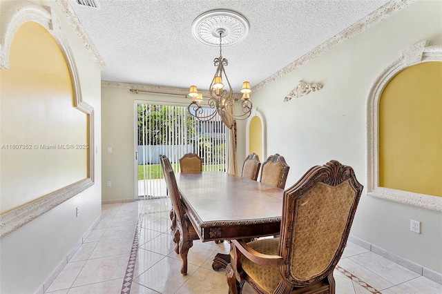 17933 SW 33rd Ct, Miramar, FL 33029 - dining room featuring a chandelier, light tile patterned floors, a textured ceiling, and inlaid floor details