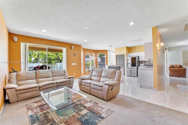 17933 SW 33rd Ct, Miramar, FL 33029 - living area featuring light carpet, recessed lighting, a textured ceiling, baseboards, and light tile patterned flooring